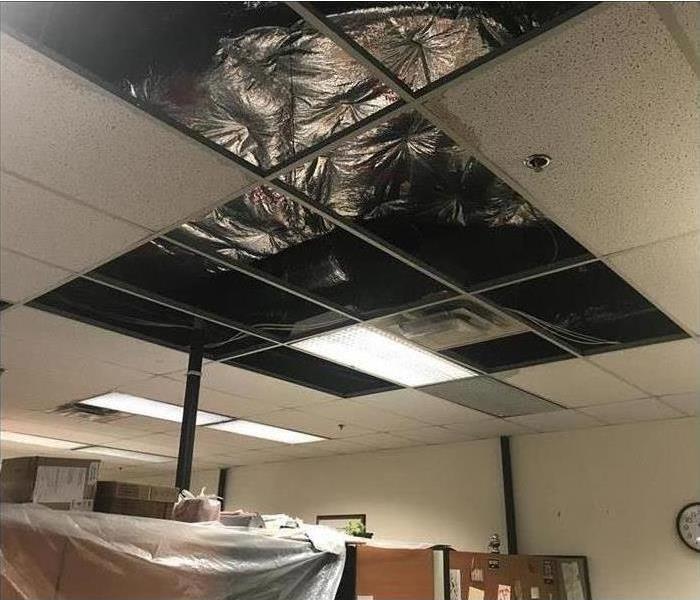 Commercial building with water damage in ceiling