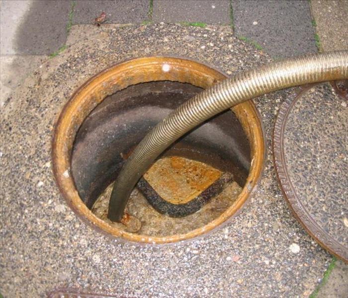 Sewage being vacuumed